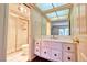A stylish bathroom featuring a vanity, toilet, and glass-enclosed shower at 940 Vegas Valley Dr, Las Vegas, NV 89109