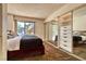Bedroom with large sliding glass doors to balcony and closet with storage at 940 Vegas Valley Dr, Las Vegas, NV 89109