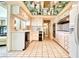 Bright kitchen with white cabinets, tiled floors and countertops at 940 Vegas Valley Dr, Las Vegas, NV 89109