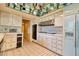 A kitchen with white cabinets, tile floors, and a mirrored ceiling at 940 Vegas Valley Dr, Las Vegas, NV 89109