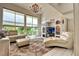 Bright living room with large windows, chandelier, and a tile floor at 940 Vegas Valley Dr, Las Vegas, NV 89109