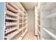 A spacious walk-in pantry with built-in shelving and patterned wallpaper at 940 Vegas Valley Dr, Las Vegas, NV 89109