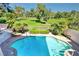 Inviting pool area overlooking lush green golf course and mature trees at 940 Vegas Valley Dr, Las Vegas, NV 89109