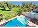 Inviting pool and spa surrounded by lush landscaping and mature trees at 940 Vegas Valley Dr, Las Vegas, NV 89109
