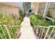 Picturesque walkway leading to the home's entrance, surrounded by lush greenery and landscaping at 940 Vegas Valley Dr, Las Vegas, NV 89109