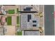Aerial view of the property with a gray roof with solar panels, and landscaped yards at 10058 Matter Overlook Dr, Las Vegas, NV 89178