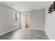 Bright bedroom featuring wood-look flooring and neutral color palette at 10058 Matter Overlook Dr, Las Vegas, NV 89178