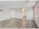Spacious bedroom with wood-look floors and ample natural light near the bathroom at 10058 Matter Overlook Dr, Las Vegas, NV 89178