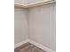An empty walk-in closet with a rod for hanging clothes at 10058 Matter Overlook Dr, Las Vegas, NV 89178