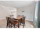 Dining area features hardwood floors, a large wooden table, and a view of the staircase at 10058 Matter Overlook Dr, Las Vegas, NV 89178
