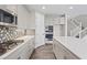 Bright, open kitchen with stainless steel appliances and views of the stairs at 10058 Matter Overlook Dr, Las Vegas, NV 89178