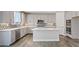Spacious kitchen featuring stainless steel appliances, white countertops and patterned backsplash at 10058 Matter Overlook Dr, Las Vegas, NV 89178