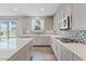 Modern kitchen featuring stainless steel appliances, white countertops and patterned backsplash at 10058 Matter Overlook Dr, Las Vegas, NV 89178