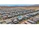 Wide aerial view of a community showcasing many single Gathering homes with various roof types at 10058 Matter Overlook Dr, Las Vegas, NV 89178