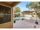 Backyard with a pool, patio, and lush landscaping, creating a private oasis for relaxation at 1125 Lumina Ct, Las Vegas, NV 89117