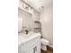 Well-lit powder room boasts a sleek vanity, modern fixtures, and floating shelves at 1125 Lumina Ct, Las Vegas, NV 89117