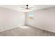 Neutral bedroom featuring natural light, soft carpeting, and modern ceiling fan at 1125 Lumina Ct, Las Vegas, NV 89117