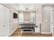 Cozy dining area with built-in bench seating, modern lighting, and wood-look floors at 1125 Lumina Ct, Las Vegas, NV 89117