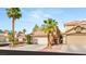 Inviting two-story home with desert landscaping, two-car garage, and tile roof at 1125 Lumina Ct, Las Vegas, NV 89117