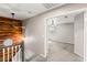 Upstairs hallway featuring wood accent wall and doorway into bedroom with ceiling fan at 1125 Lumina Ct, Las Vegas, NV 89117