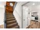 Hallway features staircase, wood accent wall and convenient access to laundry room at 1125 Lumina Ct, Las Vegas, NV 89117