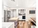 Modern kitchen with stainless steel appliances, white cabinets, island and laundry closet at 1125 Lumina Ct, Las Vegas, NV 89117