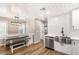 Bright kitchen features modern cabinets, stainless steel appliances, farmhouse sink and built-in dining nook at 1125 Lumina Ct, Las Vegas, NV 89117