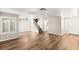 Open living room with wood floors, staircase, and plenty of natural light at 1125 Lumina Ct, Las Vegas, NV 89117