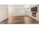 Bright living room with modern fireplace, wood floors, and ample space for entertaining at 1125 Lumina Ct, Las Vegas, NV 89117