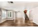 Spacious open-concept living area featuring hardwood floors, and access to the stairway at 1125 Lumina Ct, Las Vegas, NV 89117