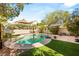 Inviting backyard pool with lush landscaping and ample space for relaxation and outdoor enjoyment at 1125 Lumina Ct, Las Vegas, NV 89117