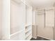 Walk-in closet featuring built-in shelves and hanging rods providing ample storage space at 1125 Lumina Ct, Las Vegas, NV 89117
