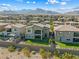 Aerial view of a two-story home with a lush backyard, mountain views, and neighborhood landscape at 12415 Notch Trail Ave, Las Vegas, NV 89138