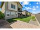 Artificial turf backyard with a brick patio and professional landscaping providing a serene outdoor living area at 12415 Notch Trail Ave, Las Vegas, NV 89138