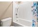 Bright bathroom featuring a shower-tub combination and decorative shower curtain at 12415 Notch Trail Ave, Las Vegas, NV 89138
