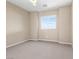 Cozy bedroom with neutral carpet and a large window with plenty of natural light at 12415 Notch Trail Ave, Las Vegas, NV 89138