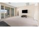 Upstairs bonus room with sliding glass doors that lead to an outdoor patio with scenic views at 12415 Notch Trail Ave, Las Vegas, NV 89138