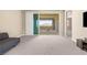 Spacious room with sliding glass doors leading to a balcony and views of the surrounding landscape at 12415 Notch Trail Ave, Las Vegas, NV 89138