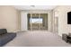 Spacious room with sliding glass doors leading to a balcony and views of the surrounding landscape at 12415 Notch Trail Ave, Las Vegas, NV 89138