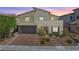 Beautiful two-story home with desert landscaping and a modern design, offering inviting curb appeal at 12415 Notch Trail Ave, Las Vegas, NV 89138