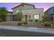 Charming two-story home featuring desert landscaping, a modern design, and inviting curb appeal at 12415 Notch Trail Ave, Las Vegas, NV 89138
