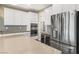 Kitchen displays custom cabinetry, beverage cooler, stainless steel appliances and large island at 12415 Notch Trail Ave, Las Vegas, NV 89138