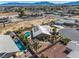 Expansive aerial view of home with a beautiful backyard oasis featuring a pool and spa at 231 Bristle Cone, Pahrump, NV 89048