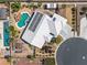 Aerial view of a home with a uniquely designed pool, solar panels, and desert landscaping at 231 Bristle Cone, Pahrump, NV 89048
