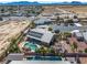 Aerial view of the single Gathering home, pool, and patio with mountain views in the distance at 231 Bristle Cone, Pahrump, NV 89048