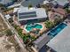 Amazing aerial view highlighting the pool, patio, and desert landscape in a single Gathering community at 231 Bristle Cone, Pahrump, NV 89048
