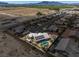 Aerial view of home with a backyard oasis, solar panels, desert landscaping, and mature trees at 231 Bristle Cone, Pahrump, NV 89048