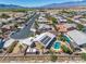A lovely aerial view of a single Gathering home with a pool, desert landscape, and mountain views at 231 Bristle Cone, Pahrump, NV 89048