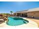 Backyard with a pool and spa, and patio area perfect for relaxing or entertaining at 231 Bristle Cone, Pahrump, NV 89048