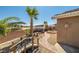 Landscaped backyard featuring a decorative brick walkway, bridge, and desert landscaping at 231 Bristle Cone, Pahrump, NV 89048